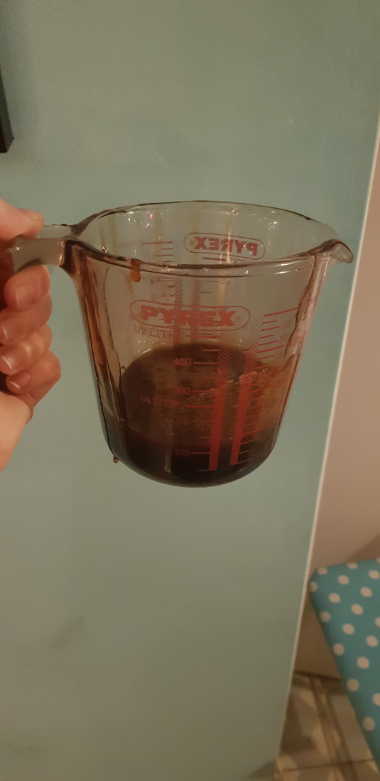 Rosehip syrup in a jug